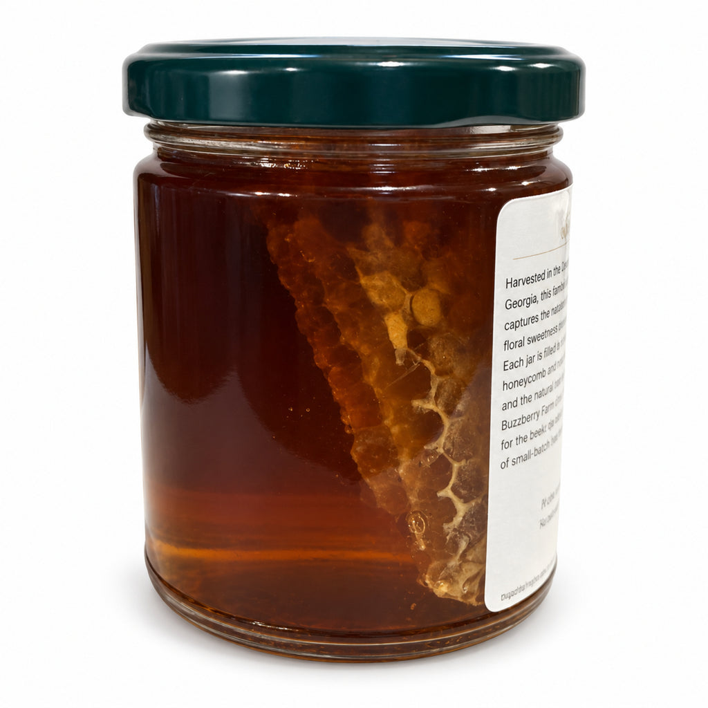 Buzzberry Farms Sourwood Honey with Cut Comb, 12 oz glass jar — rear view showing cut comb